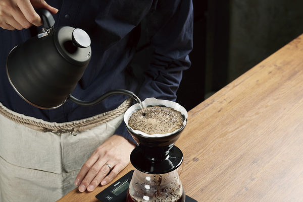 Pouring hot water into a Hario V60 Dripper Kasuya Model